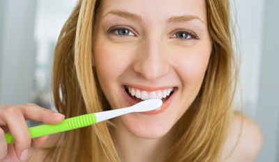 woman brushing teeth